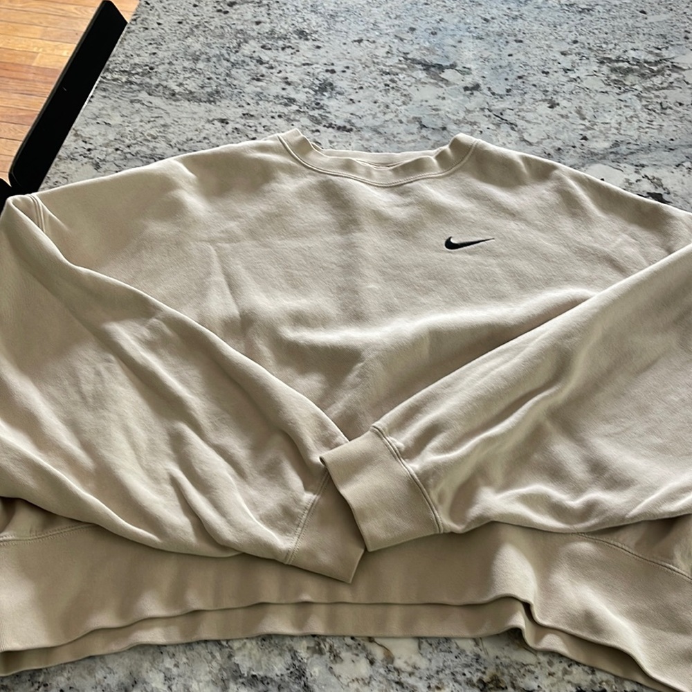 Cream Nike medium dolman sleeve oversized sweatshirt.